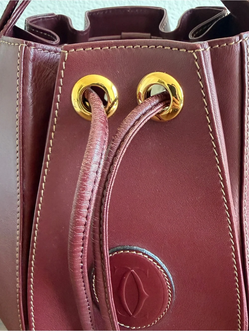 Leather Cartier Drawstring Bucket Bag in Deep Burgundy